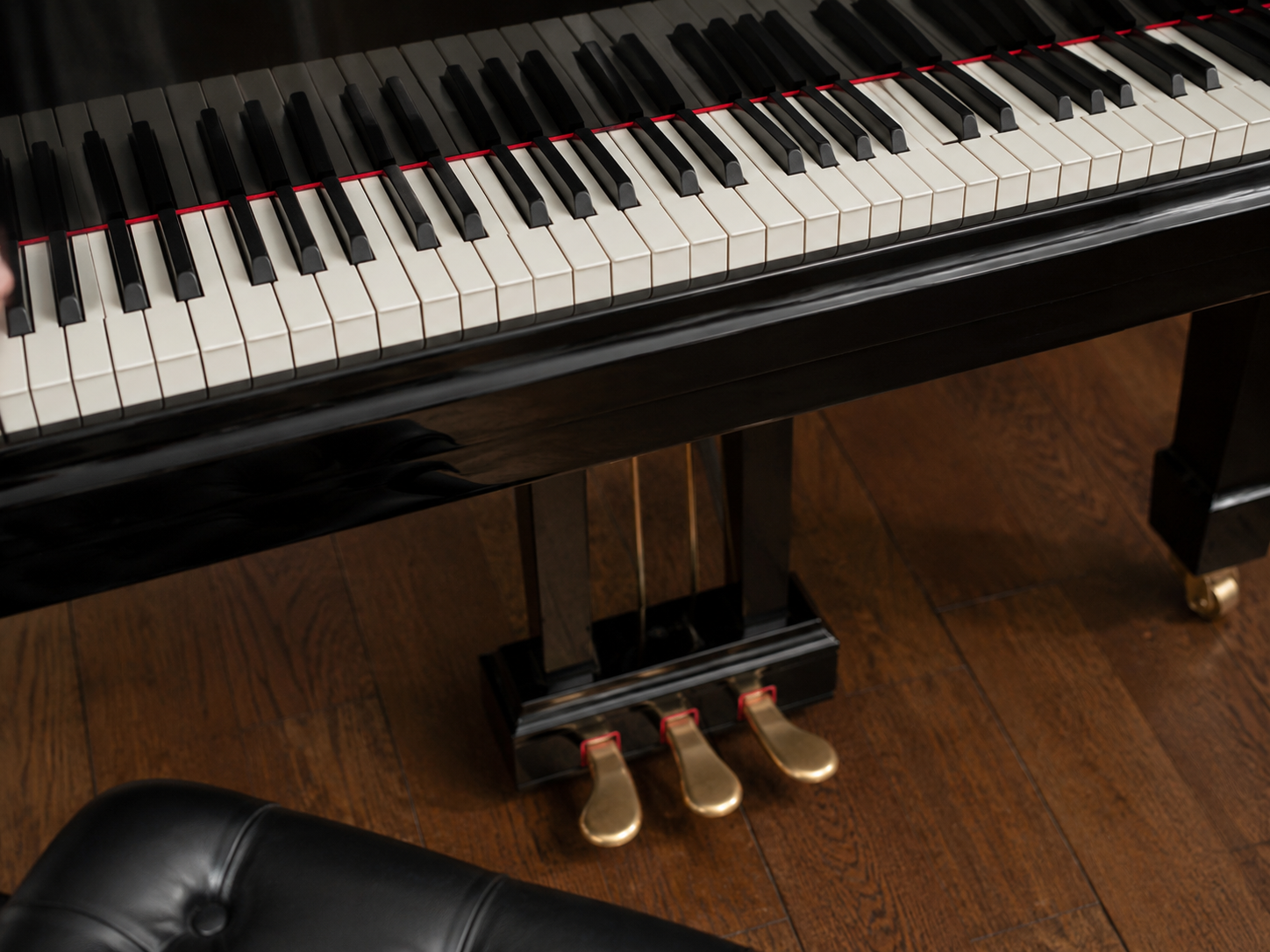 Checking the keyboard and pedals of a used Grand Piano before buying